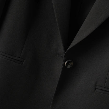 Elegant mid-length black womens blazer for autumn and winter simple one-button design with a slimming drape effect suitable for commuting