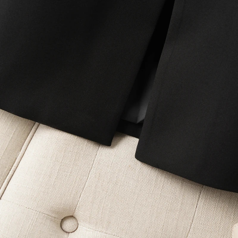 Elegant mid-length black womens blazer for autumn and winter simple one-button design with a slimming drape effect suitable for commuting