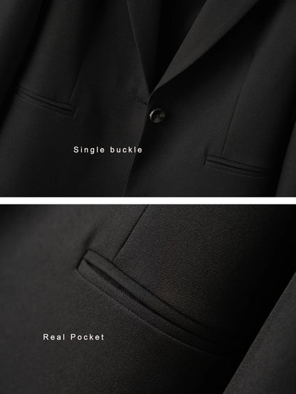 Elegant mid-length black womens blazer for autumn and winter simple one-button design with a slimming drape effect suitable for commuting